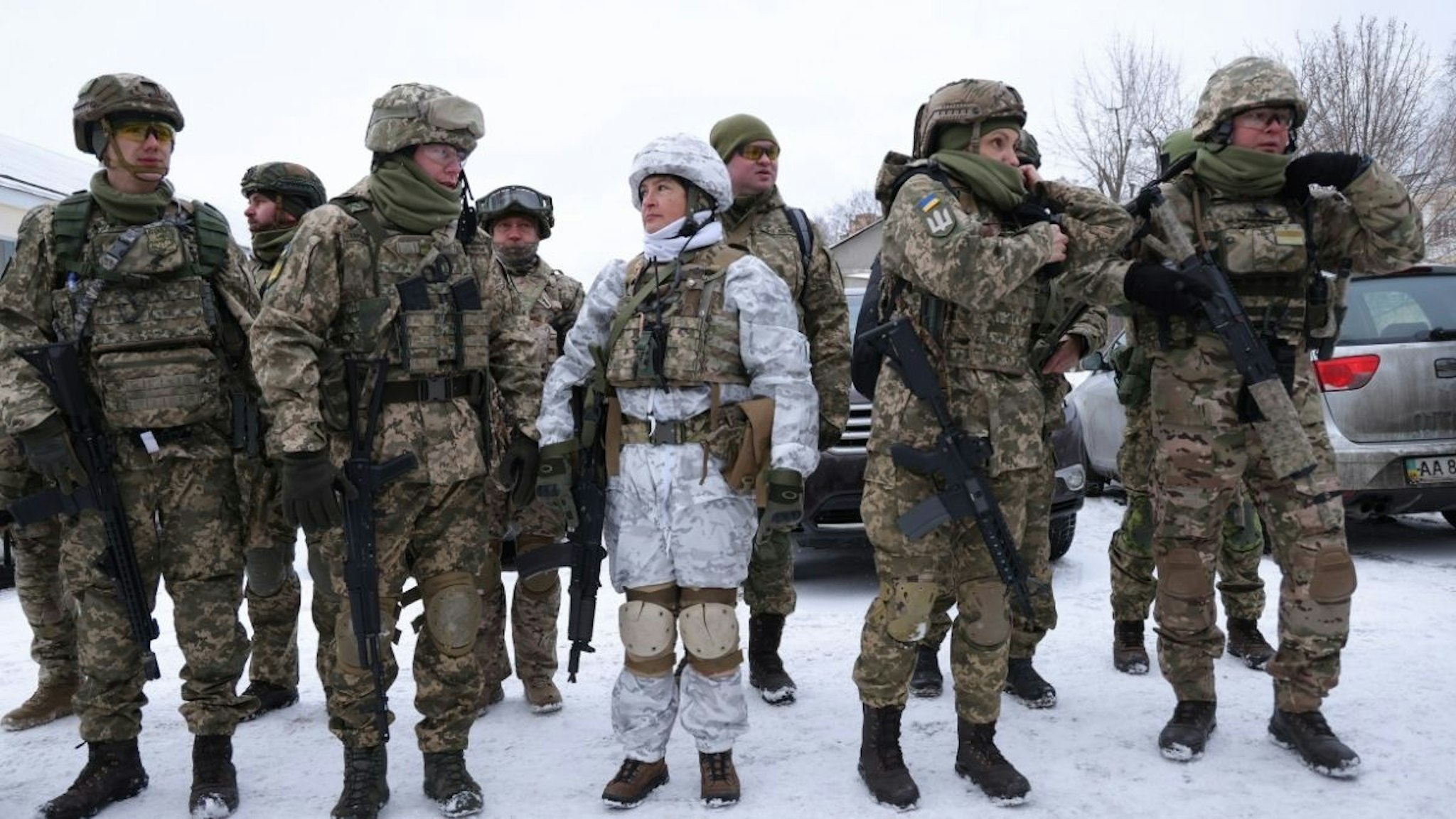 Civilian participants in a Kyiv Territorial Defence unit, including Mariana (C), 52, a marketing researcher, arrive to train on a Saturday in a forest on January 22, 2022 in Kyiv, Ukraine.
