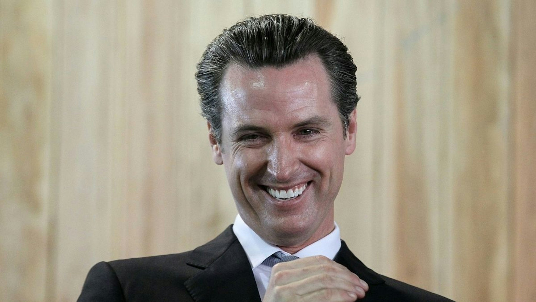 San Francisco mayor and California Lt. Governor-elect Gavin Newsom smiles during a ribbon cutting during the grand opening of the Lowe's store on November 4, 2010 in San Francisco, California.