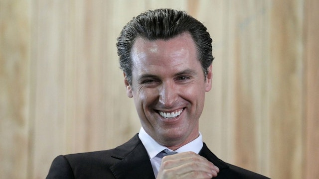 San Francisco mayor and California Lt. Governor-elect Gavin Newsom smiles during a ribbon cutting during the grand opening of the Lowe's store on November 4, 2010 in San Francisco, California.