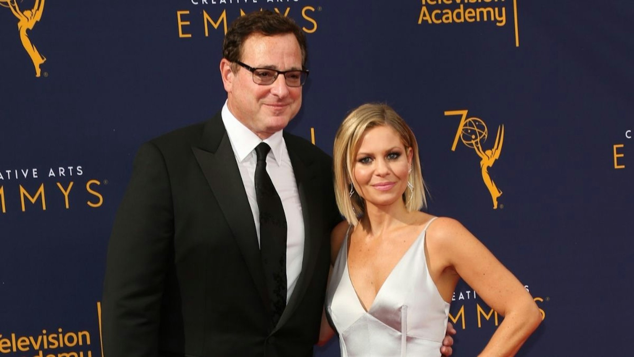 Actors Bob Saget (L) and Candace Cameron Bure (R) attend the 2018 Creative Arts Emmy Awards at Microsoft Theater on September 8, 2018 in Los Angeles, California.