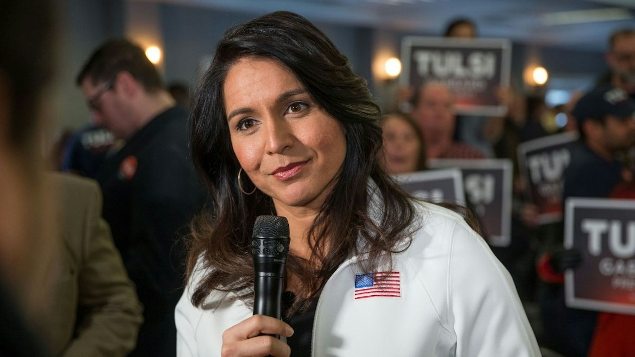 Democratic presidential candidate Rep. Tulsi Gabbard (D-HI) answers media questions following a campaign event on February 9, 2020 in Portsmouth, New Hampshire. The first in the nation primary is on Tuesday, February 11.