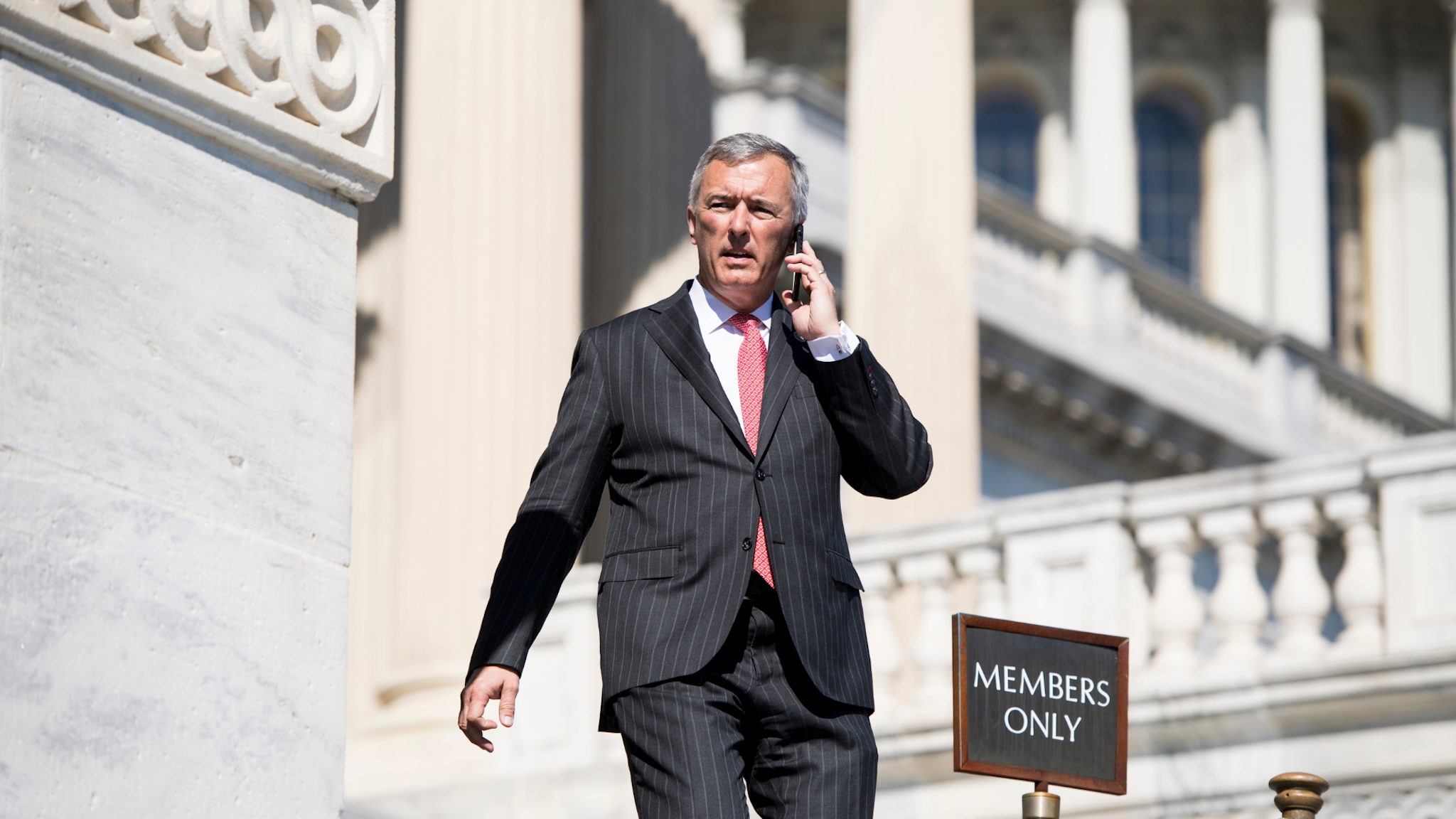 Rep. John Katko... UNITED STATES - MARCH 7: Rep. John Katko, R-N.Y., walks down the House steps after final votes of the week in the Capitol on March 8, 2018.