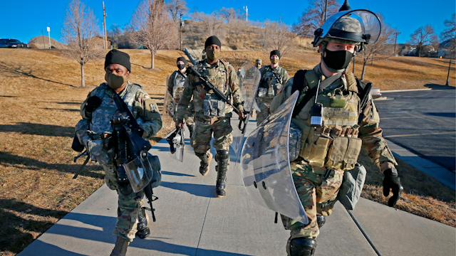 Utah National Guardsmen arrive at the Utah State Capitol building to provide security in Salt Lake City, Utah on January 20, 2021. - The FBI has reported there have been threats of violence at State Capitols through out the United States on inauguration of US President Elect Joe Biden.