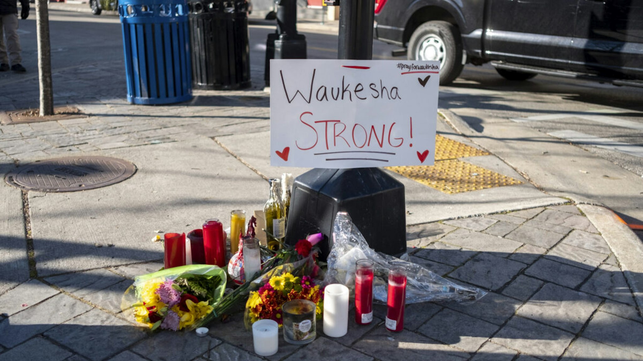 NOVEMBER 23: Memorials placed along Main Street in downtown Waukesha Wisconsin left in areas where people were hit by a driver plowing into the Christmas parade on Main Street in downtown November 22, 2021 in Waukesha, Wisconsin.