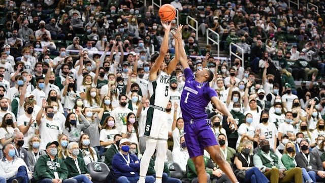 EAST LANSING, MI - JANUARY 15: Michigan State Spartans guard Max Christie (5) shoots over the top of Northwestern Wildcats guard Chase Audige (1) during a college basketball game between the Michigan State Spartans and the Northwestern Wildcats on January 15, 2022 at the Breslin Student Events Center in East Lansing, MI.(Photo by