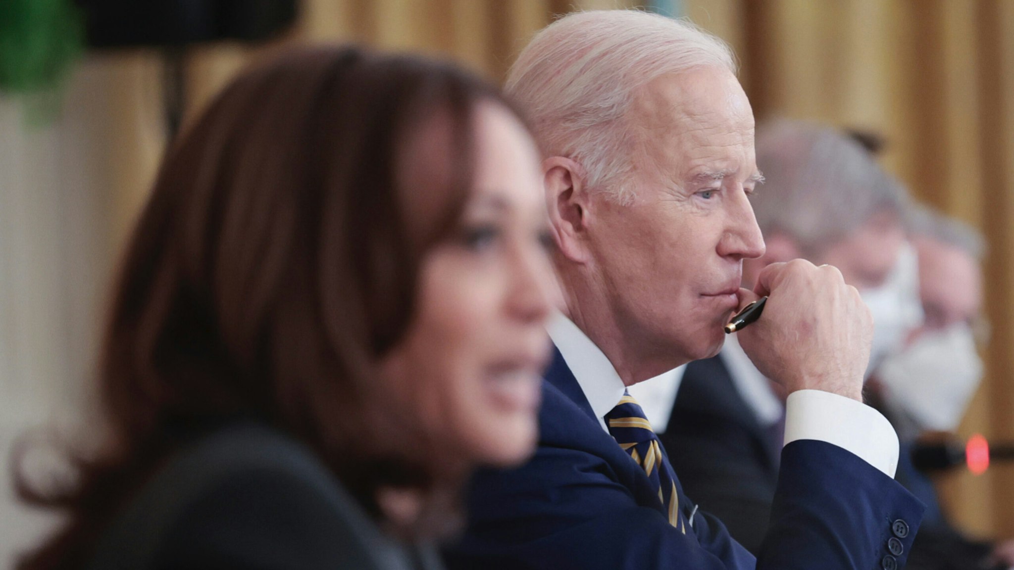 U.S. President Joe Biden listens as Vice president Kamala Harris (L) speaks during an event at the White House with members of the National Governors Association on January 31, 2022 in Washington, DC.