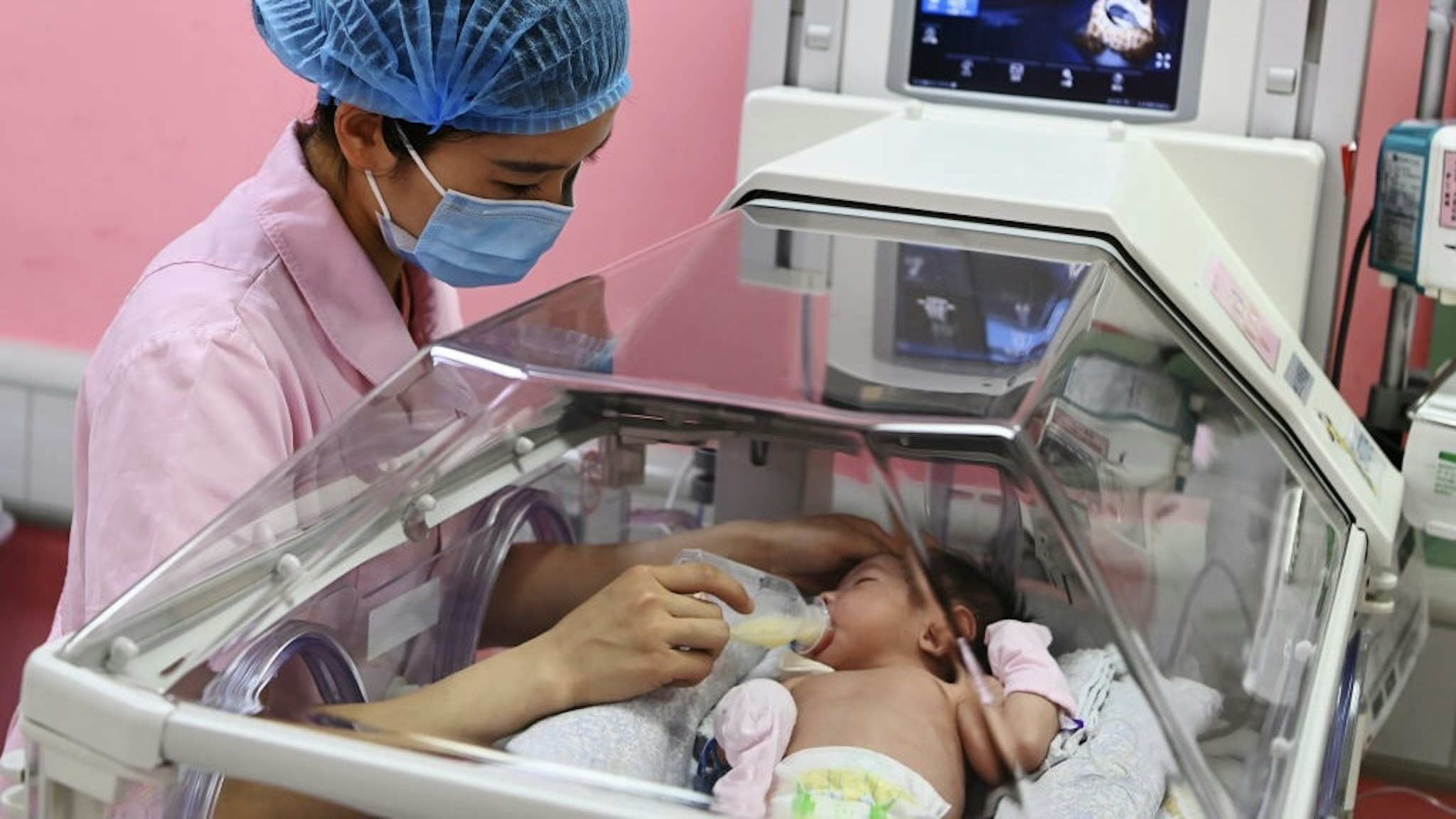 International Nurses Day Marked In China CHENGDU, CHINA - MAY 11: A nurse feeds milk to a newborn baby at a hospital on May 11, 2021 in Chengdu, Sichuan Province of China. International Nurses Day is observed annually on May 12. (Photo by An Yuan/China News Service via Getty Images) China News Service / Contributor
