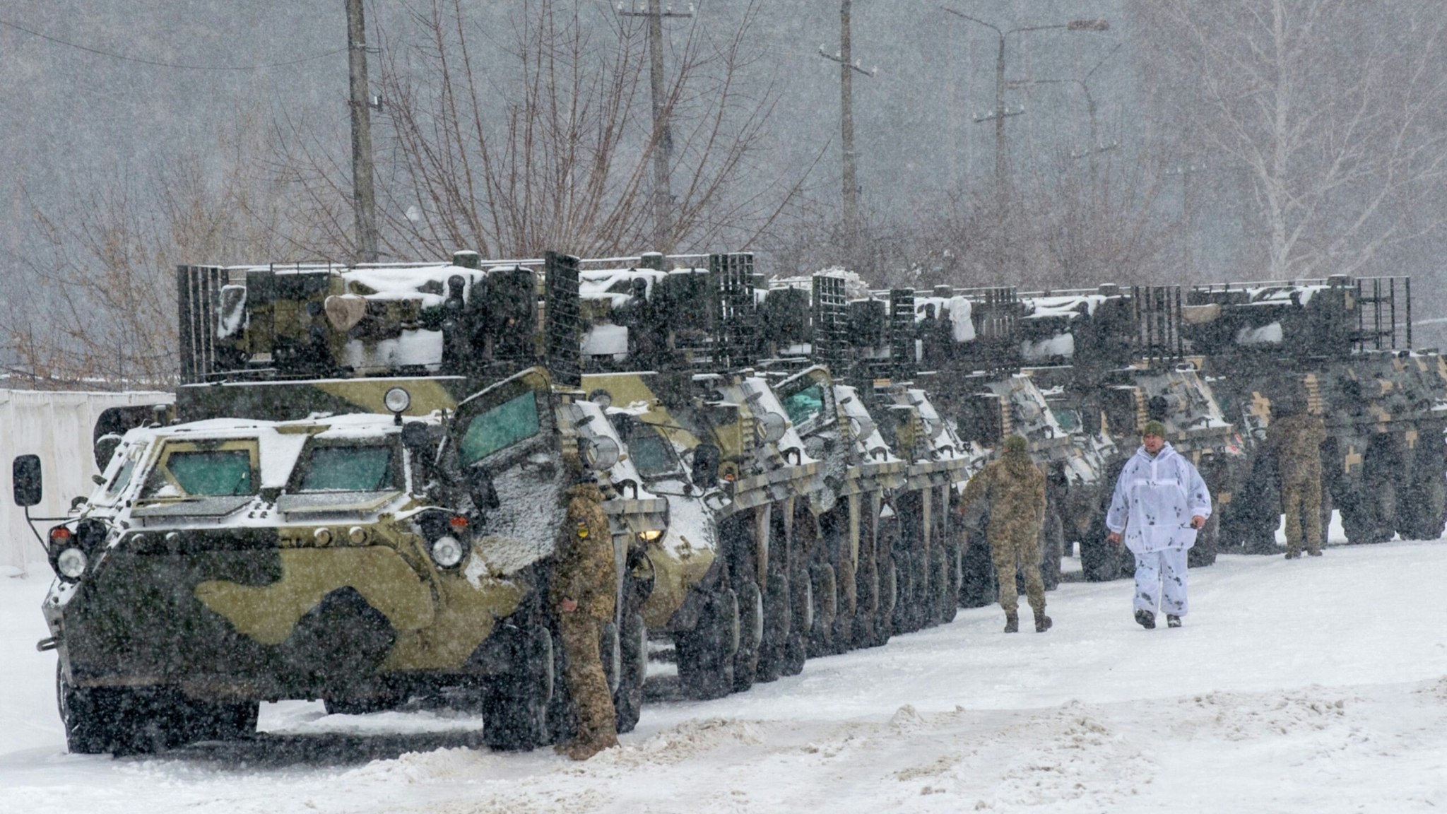 Armored personnel carrier (APC) of the 92nd separate mechanized brigade of Ukrainian Armed Forces move to park in their base near Klugino-Bashkirivka village, in the Kharkiv region on January 31, 2022.