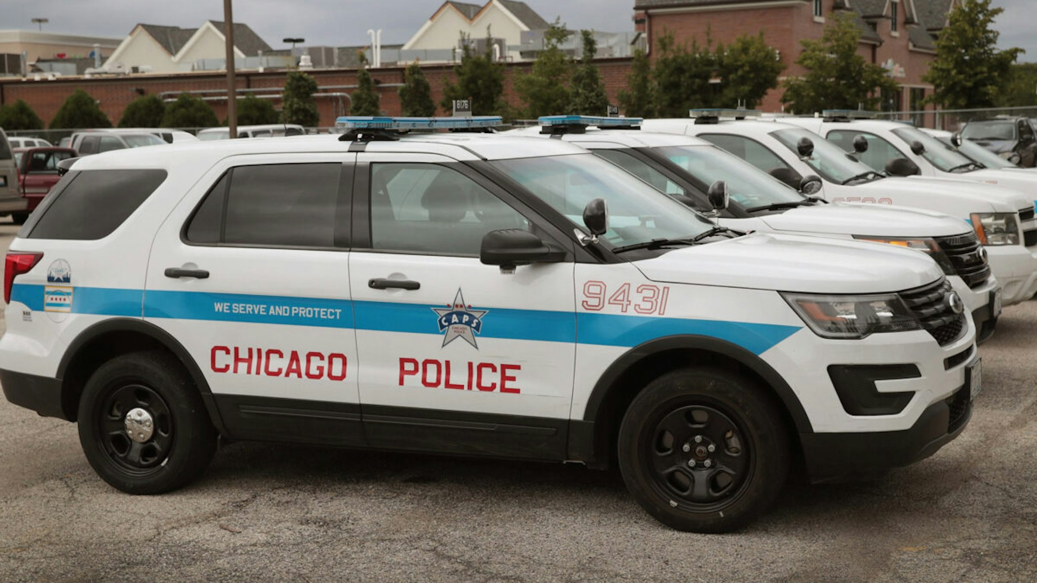 Ford Explorer based Police Interceptors sit in a police station parking lot on August 4, 2017 in Chicago, Illinois.