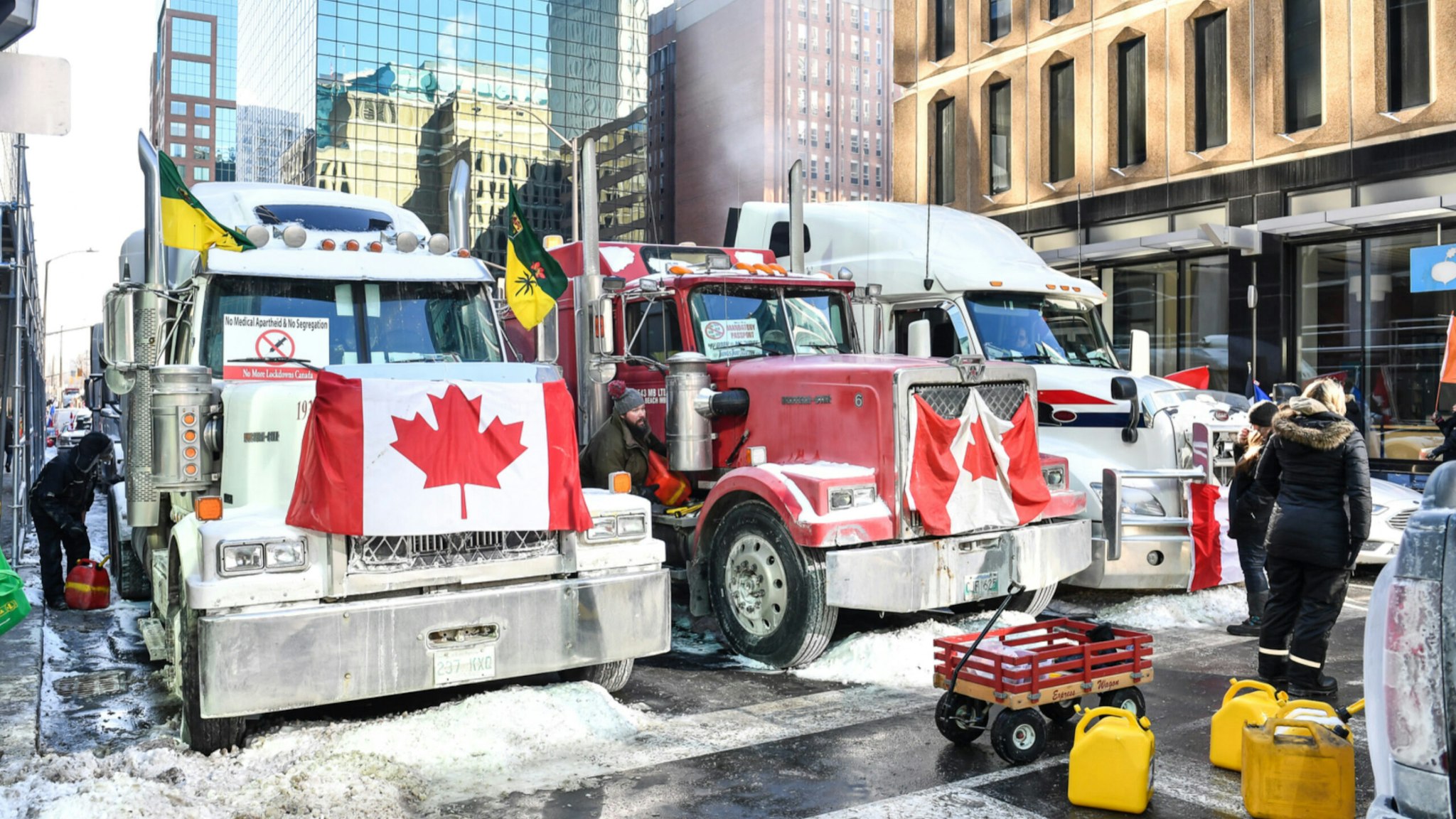 Truckers refuel their trucks in the cold during the Freedom Convoy truck protest on February 5, 2022 in Ottawa, Canada.