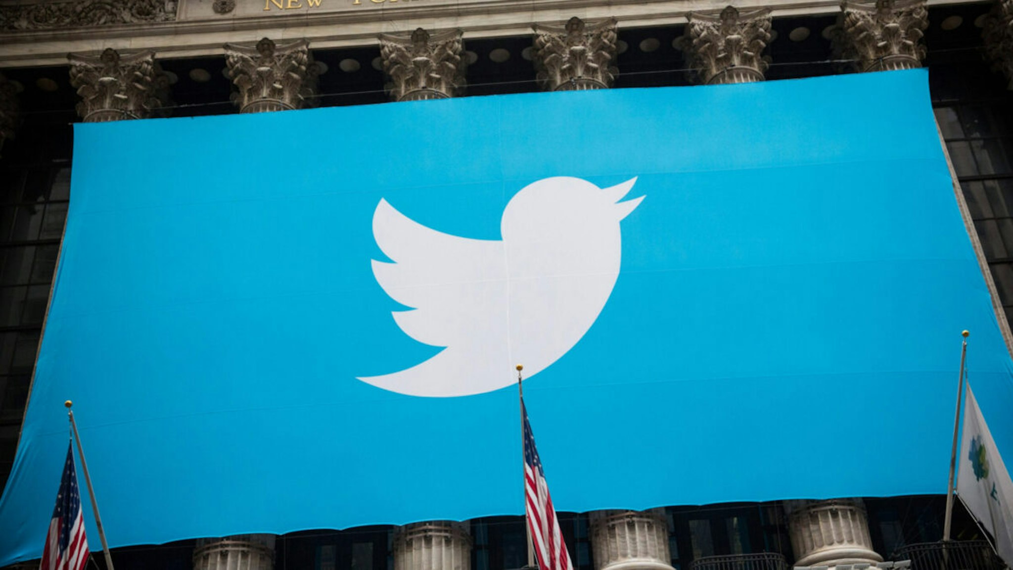 The Twitter logo is displayed on a banner outside the New York Stock Exchange (NYSE) on November 7, 2013 in New York City.