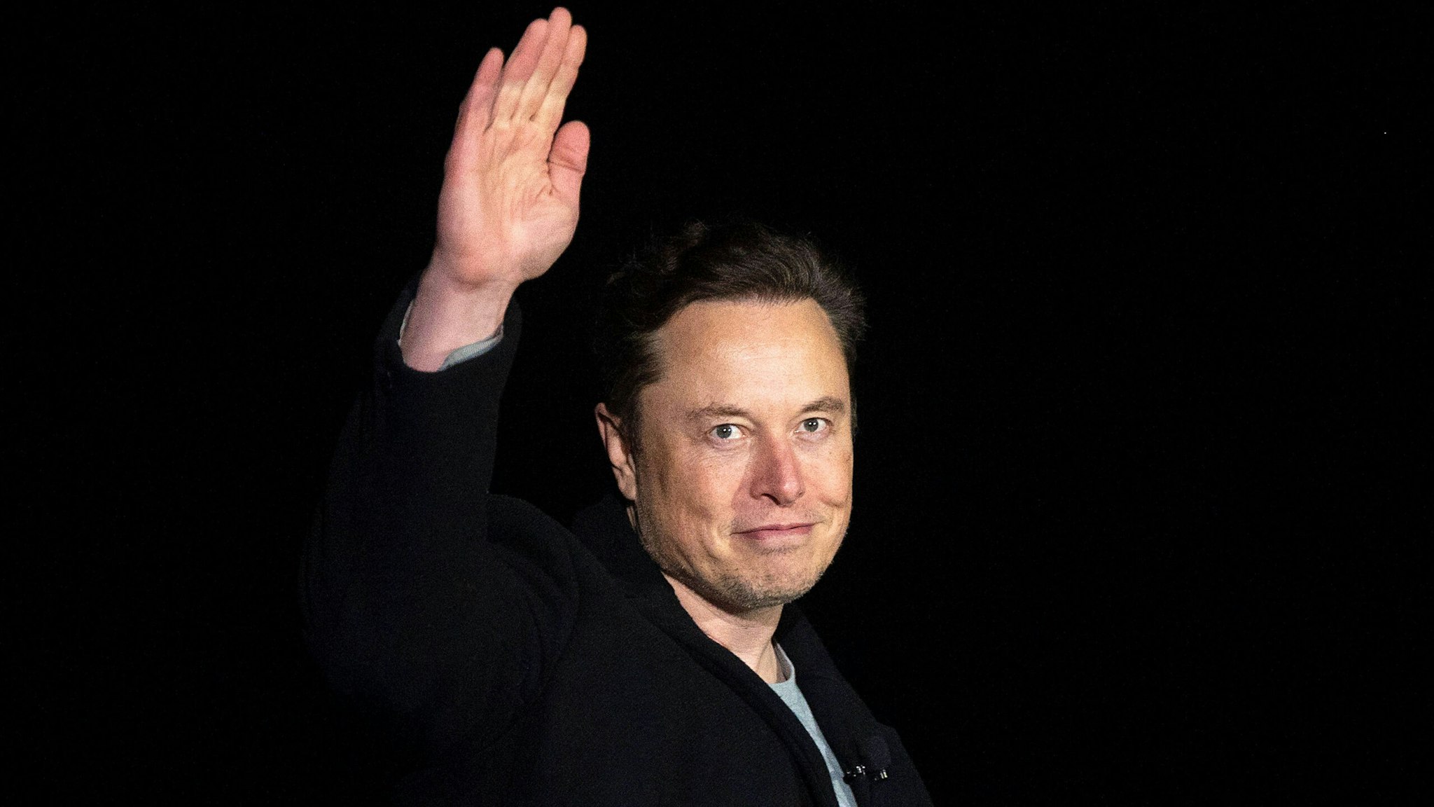 Elon Musk gestures as he speaks during a press conference at SpaceX's Starbase facility near Boca Chica Village in South Texas on February 10, 2022. - Billionaire entrepreneur Elon Musk delivered an eagerly-awaited update on SpaceX's Starship, a prototype rocket the company is developing for crewed interplanetary exploration.