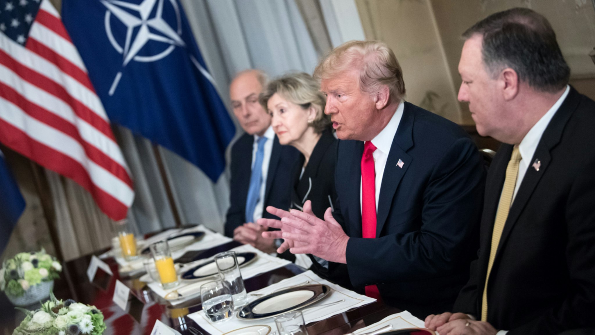 11 July 2018, Brussels, Belgium: Donald Trump, President of the United States of America, speaks with NATO Secretary General Stoltenberg at the Brussel residence of the American Ambassador during the NATO Summit.