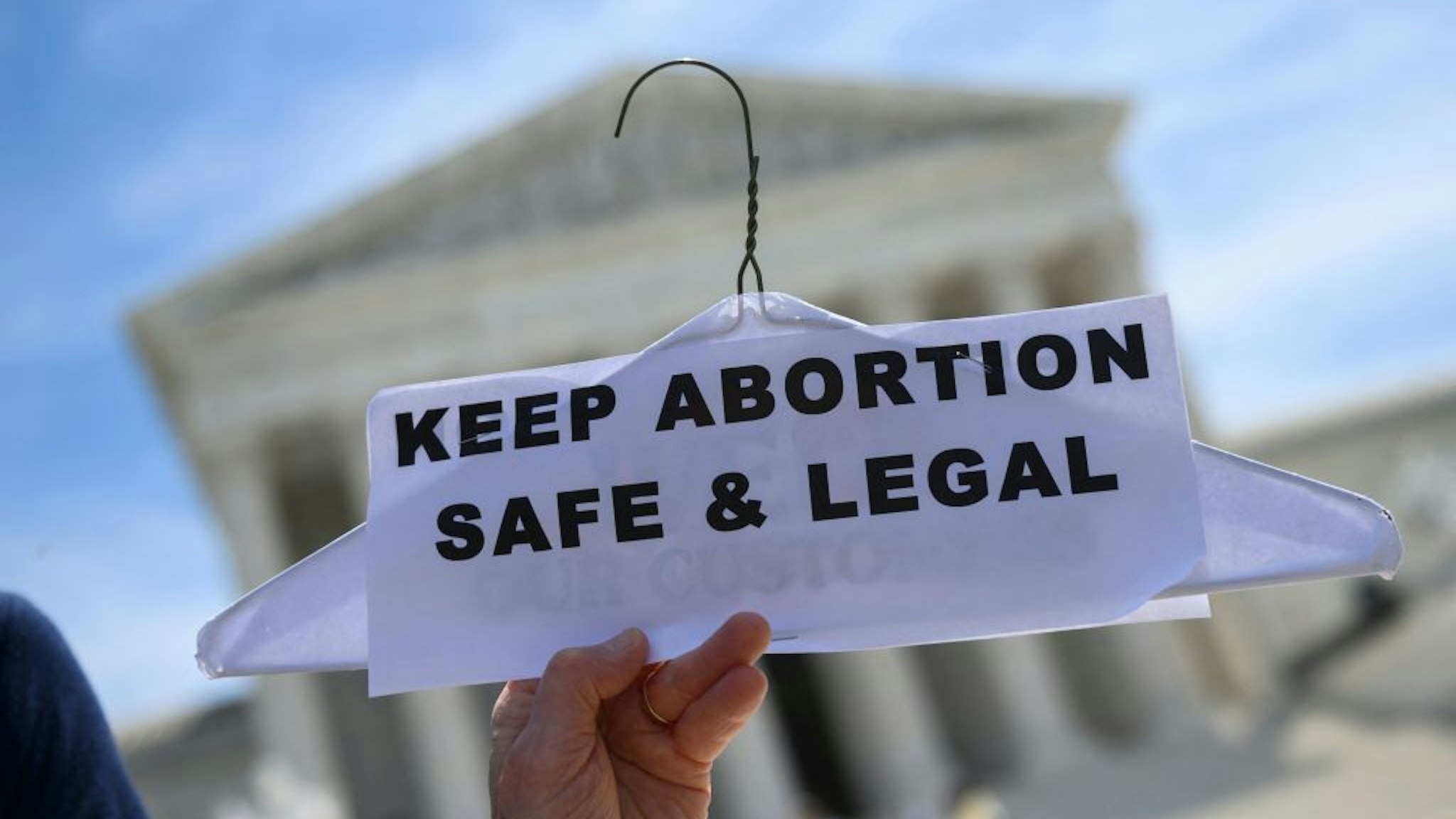 TOPSHOT - Abortion rights activists rally in front of the US Supreme Court in Washington, DC, on May 21, 2019. - Demonstrations were planned across the US on Tuesday in defense of abortion rights, which activists see as increasingly under attack. The "Day of Action" rallies come after the state of Alabama passed the country's most restrictive abortion ban, prohibiting the procedure in all cases, even rape and incest, unless the mother's life is at risk. Alabama is among about 14 states which have adopted laws banning or drastically restricting access to abortion, according to activists. (Photo by Andrew CABALLERO-REYNOLDS / AFP) (Photo by ANDREW CABALLERO-REYNOLDS/AFP via Getty Images)