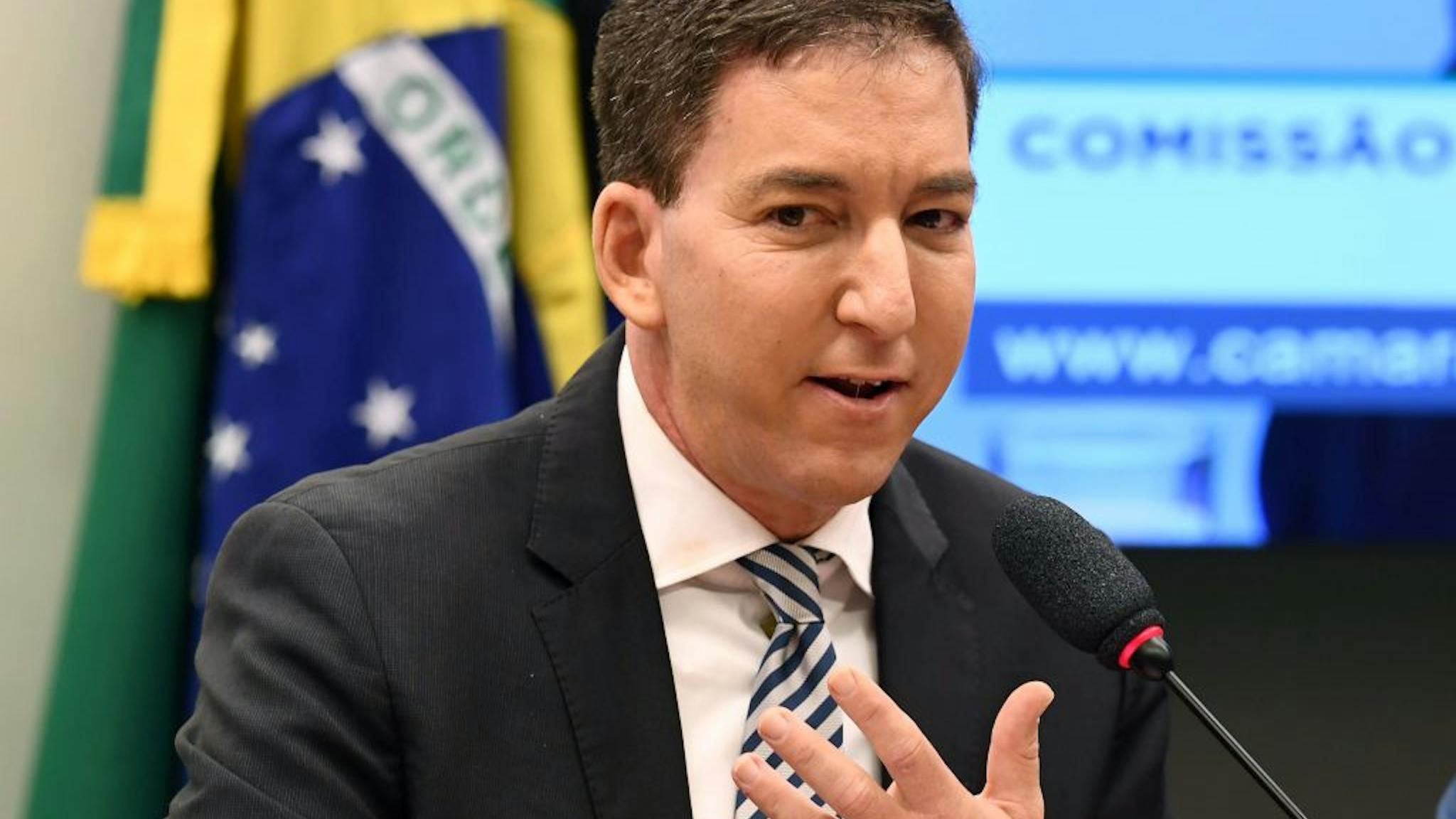 BRAZIL-POLITICS-CORRUPTION-INTERCEPT-GREENWALD US journalist Glenn Greenwald, founder and editor of The Intercept website gestures during a hearing at the Lower House's Human Rights Commission in Brasilia, Brazil, on June 25, 2019. - The Intercept has been publishing alleged conversations between Justice Minister and former judge Sergio Moro and prosecutors of Operation Lava Jato, which would have been hacked from their mobile phones. (Photo by EVARISTO SA / AFP) (Photo by EVARISTO SA/AFP via Getty Images)