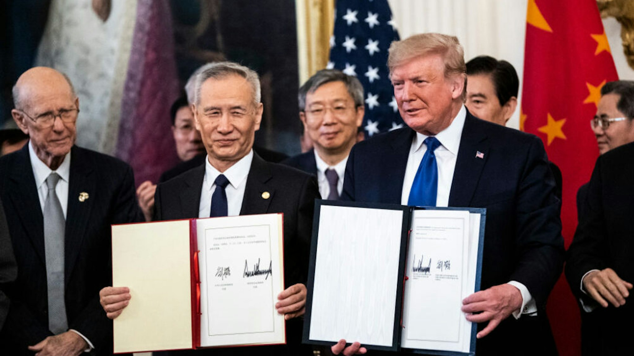 WASHINGTON, DC - JANUARY 15 : President Donald J. Trump signs a trade agreement with Chinese Vice Premier of the People's Republic of China, Liu He in the East Room at the White House on Wednesday, Jan 15, 2020 in Washington, DC.
