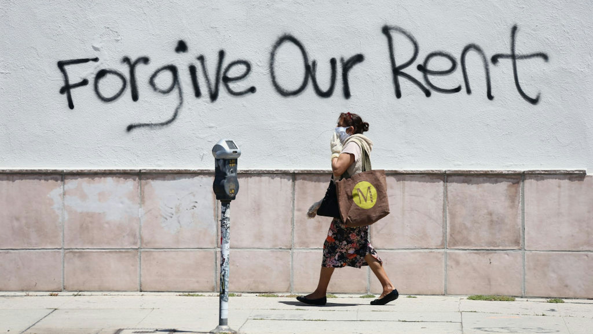 LOS ANGELES, CALIFORNIA - MAY 01: Graffiti supporting the rent strike appear on La Brea Ave. during the coronavirus pandemic on May 01, 2020 in Los Angeles, California. COVID-19 has spread to most countries around the world, claiming over 235,000 lives and infected over 3.3 million people. (Photo by Tommaso Boddi/Getty Images)