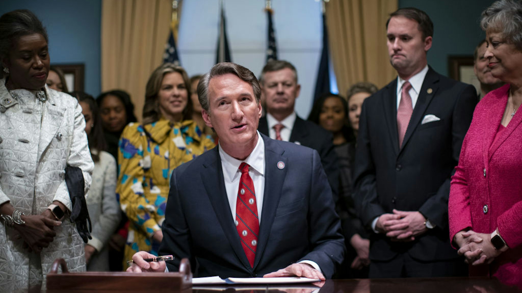 Glenn Youngkin, governor of Virginia, speaks as he signs executive actions in the Virginia State Capitol in Richmond, Virginia, U.S., on Saturday, Jan. 15, 2022. Youngkin, former co-CEO of the Carlyle Group Inc., is the first Republican elected to the office since 2009.