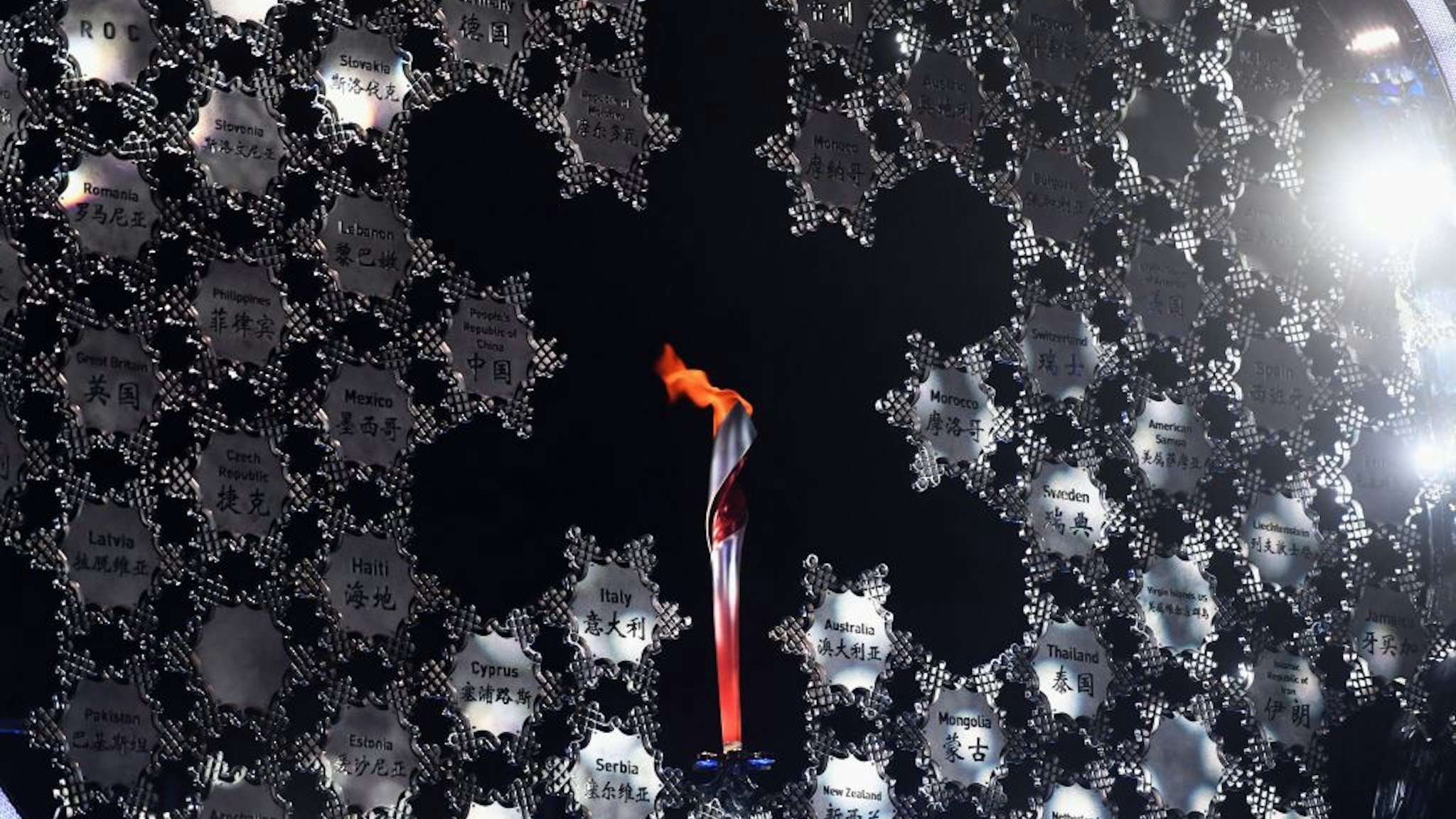 Picture of the Olympic cauldron in Zhangjiakou, China's Hebei Province, after being lit by torch bearer Wang Wenzhuo after the opening ceremony of the Beijing 2022 Winter Olympic Games in Beijing, on February 4, 2022. (Photo by Zhu Xudong / various sources / AFP) (Photo by ZHU XUDONG/AFP via Getty Images)