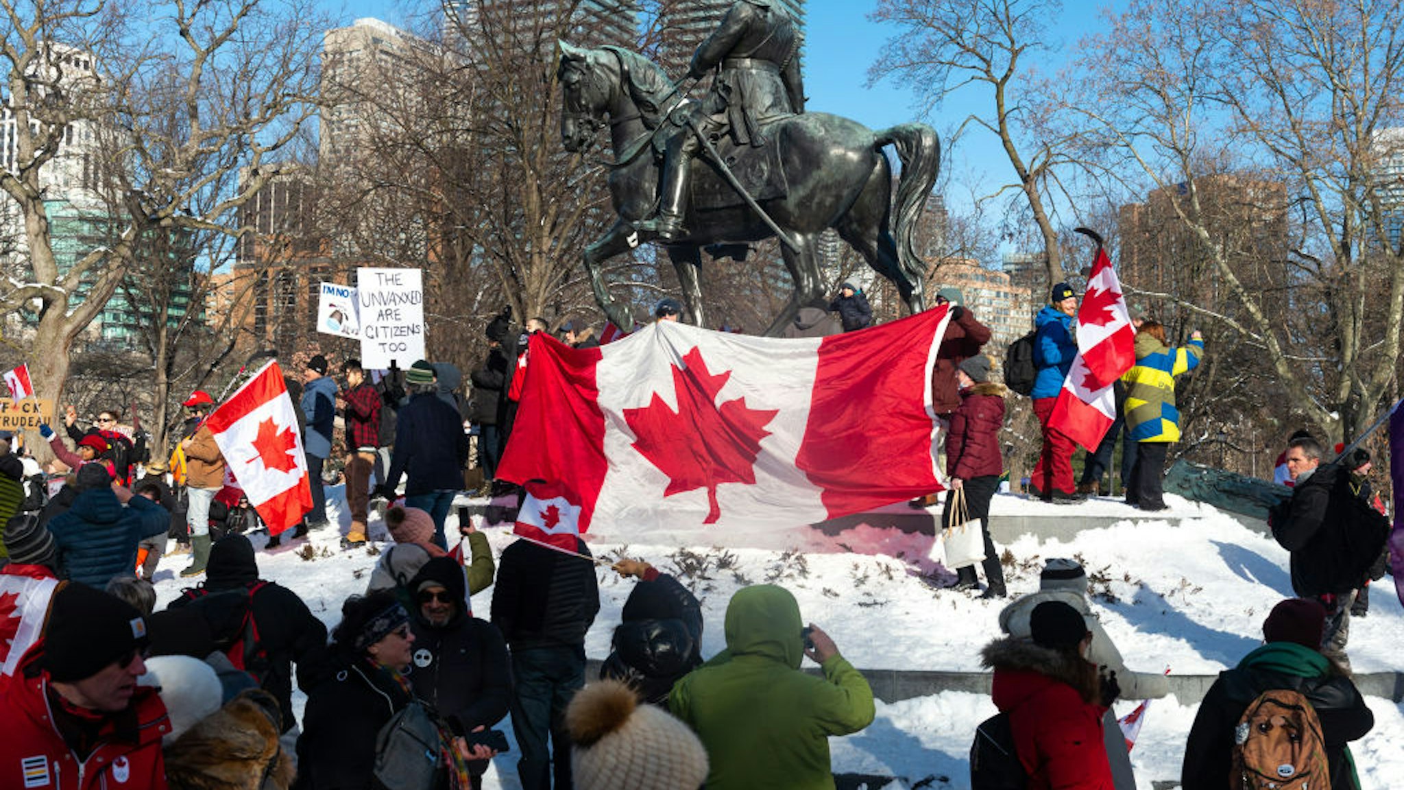 Demonstrators gather for a protest against Covid-19 vaccine mandates and restrictions in downtown Toronto, Canada, on February 5, 2022. Protesters again poured into Toronto and Ottawa early on February 5 to join a convoy of truckers whose occupation of Ottawa to denounce Covid vaccine mandates is now in its second week (Photo by Anatoliy Cherkasov/NurPhoto via Getty Images)
