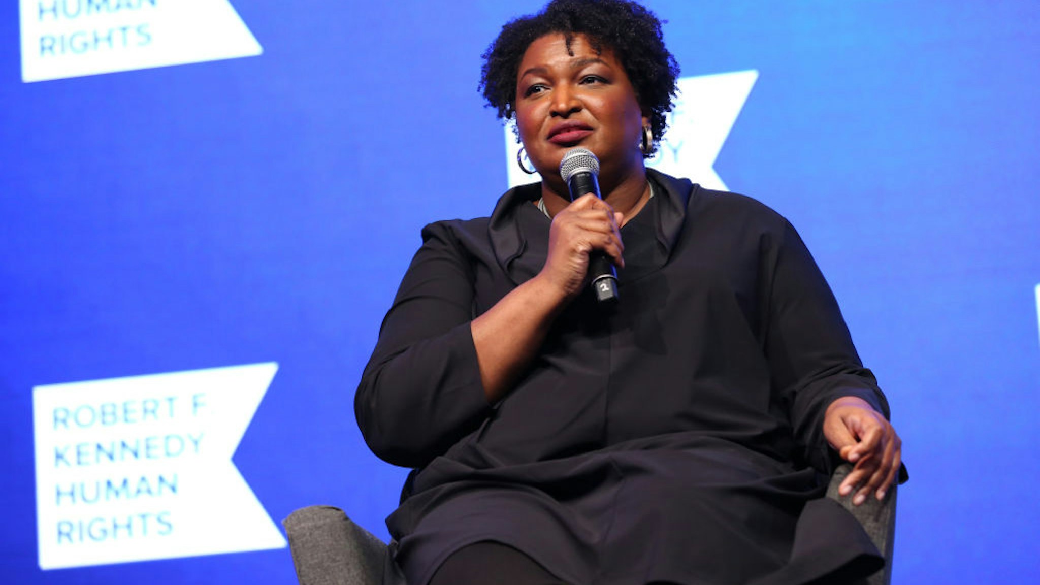 NEW YORK, NEW YORK - DECEMBER 09: Stacey Abrams speaks onstage during the 2021 Robert F. Kennedy Human Rights Ripple of Hope Award Gala on December 09, 2021 in New York City. (Photo by Monica Schipper/Getty Images for Robert F. Kennedy Human Rights)
