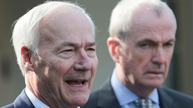 Arkansas Gov. Asa Hutchinson (L) (R-AR), Chairman of the National Governors Association, and New Jersey Gov. Phil Murphy (D-NJ) (R) speak outside the White House after a meeting with U.S. President Joe Biden and members of the National Governors Association on January 31, 2022 in Washington, DC.