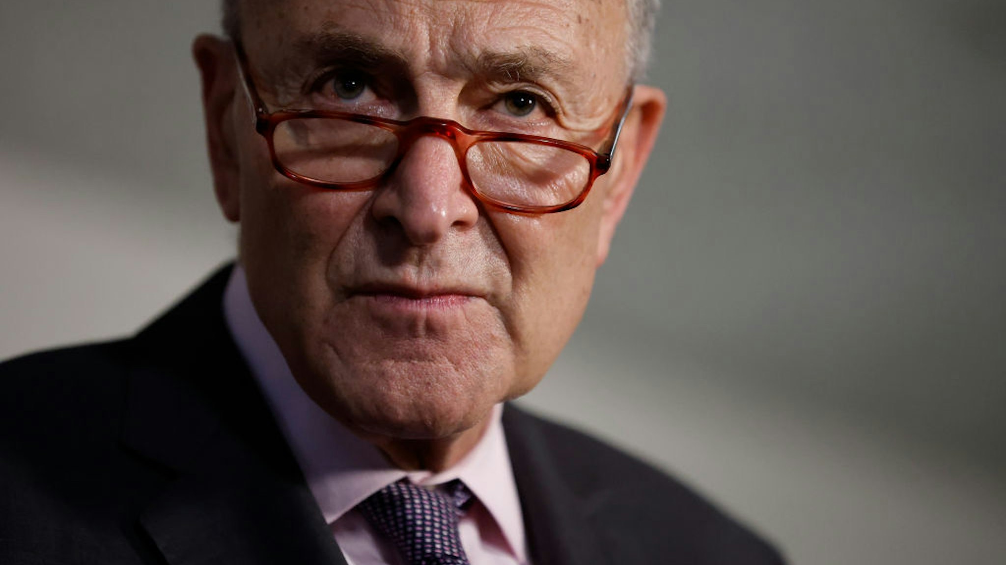 Senate Majority Leader Charles Schumer (D-NY) talks to reporters following the weekly Senate Democratic policy luncheon in the Hart Senate Office Building on Capitol Hill on February 01, 2022 in Washington, DC.