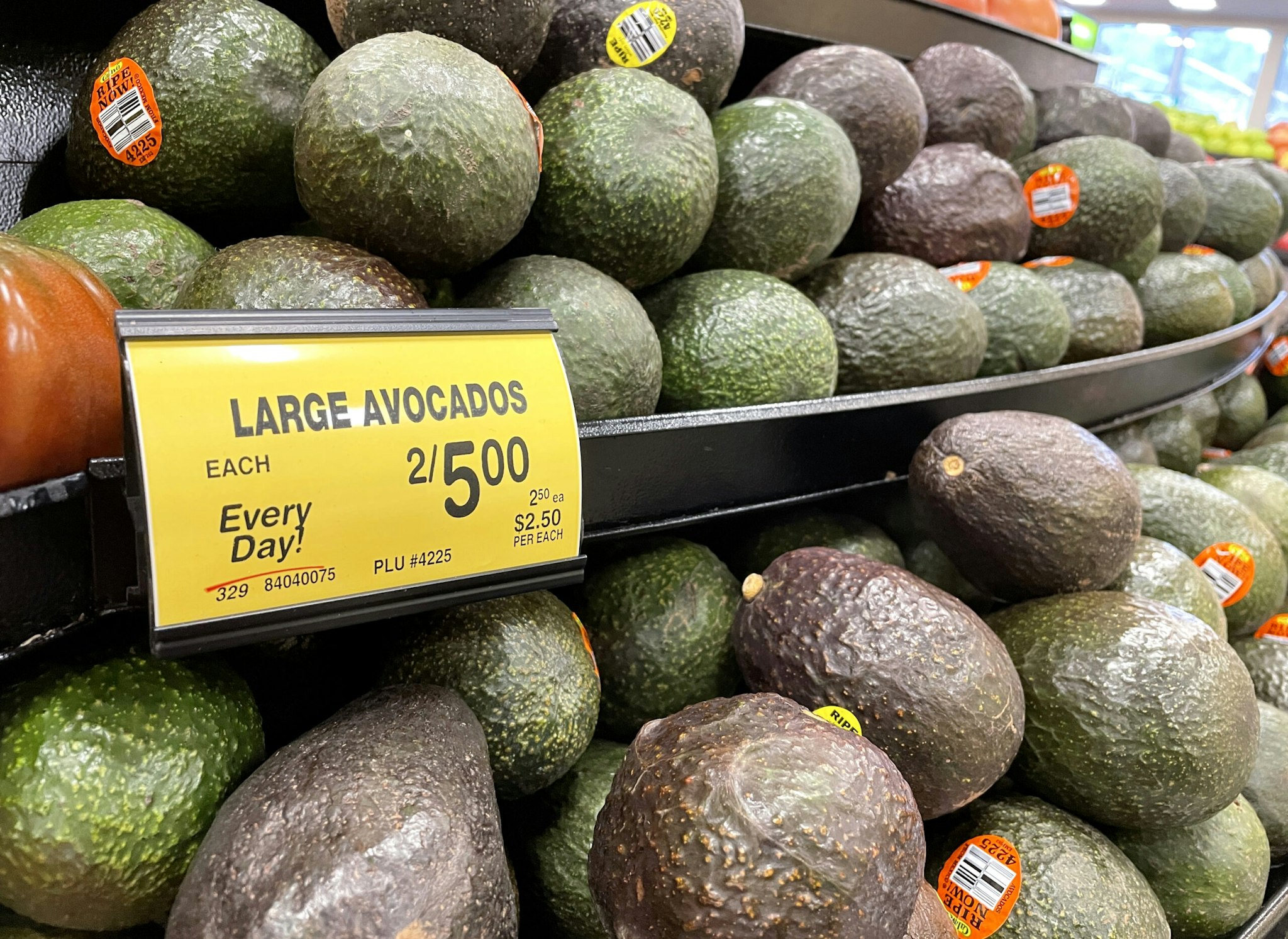 SAN ANSELMO, CALIFORNIA - FEBRUARY 07: Hass avocados are displayed in the produce section at a Safeway store on February 07, 2022 in San Anselmo, California. A week ahead of Super Bowl Sunday, the price of fresh avocados and guacamole is surging as the popular fruit is facing supply chain issues. According to a report by Bloomberg News, the price of avocados from the Michoacan growing region in Mexico has reached the highest level in two decades with a 20 pound case selling for approximately $26. Americans consume more avocados and guacamole on Super Bowl Sunday than any other day in a typical year.