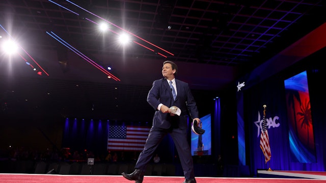 ORLANDO, FLORIDA - FEBRUARY 24: Florida Gov. Ron DeSantis tosses a hat to the crowd before speaking at the Conservative Political Action Conference (CPAC) at The Rosen Shingle Creek on February 24, 2022 in Orlando, Florida. CPAC, which began in 1974, is an annual political conference attended by conservative activists and elected officials. (Photo by
