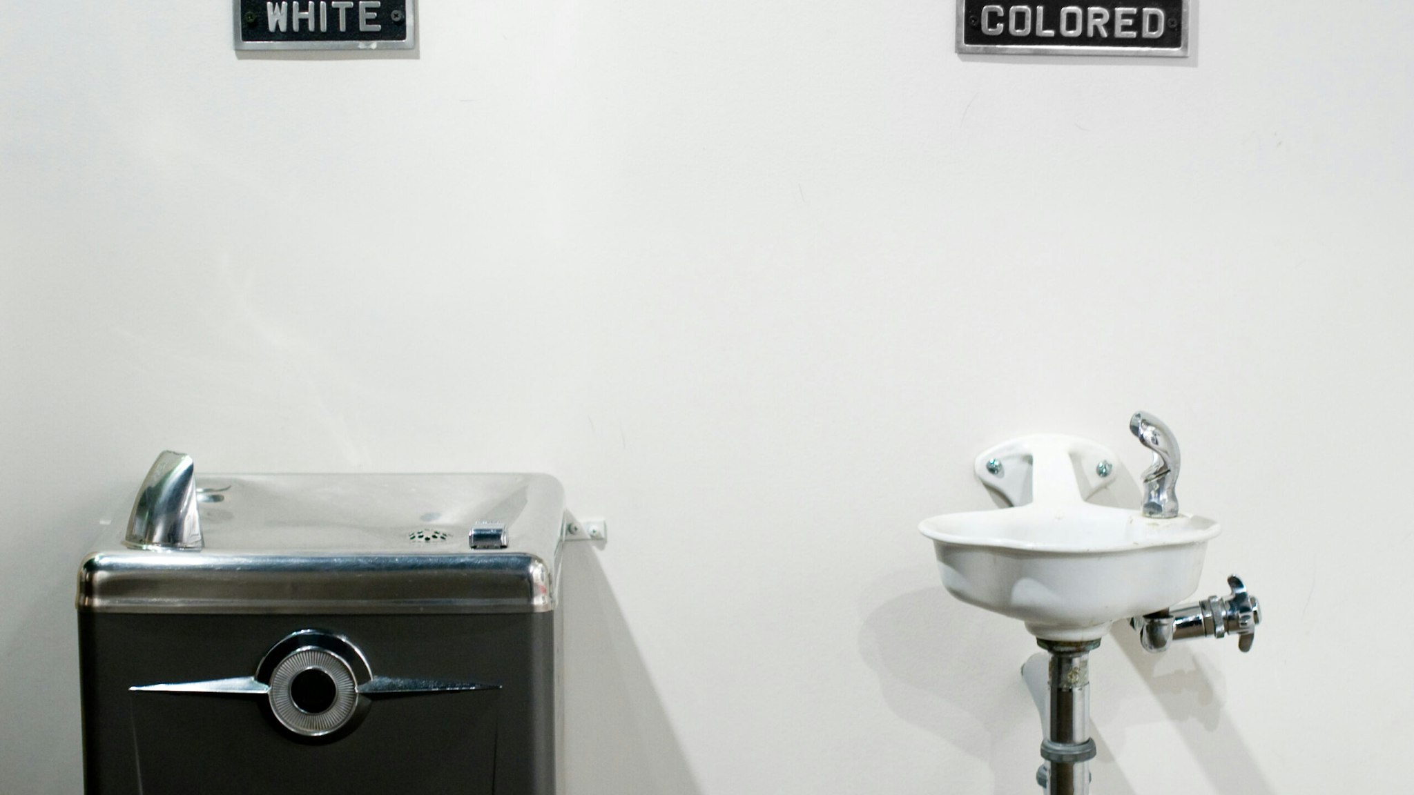 Segregated water fountains - stock photo