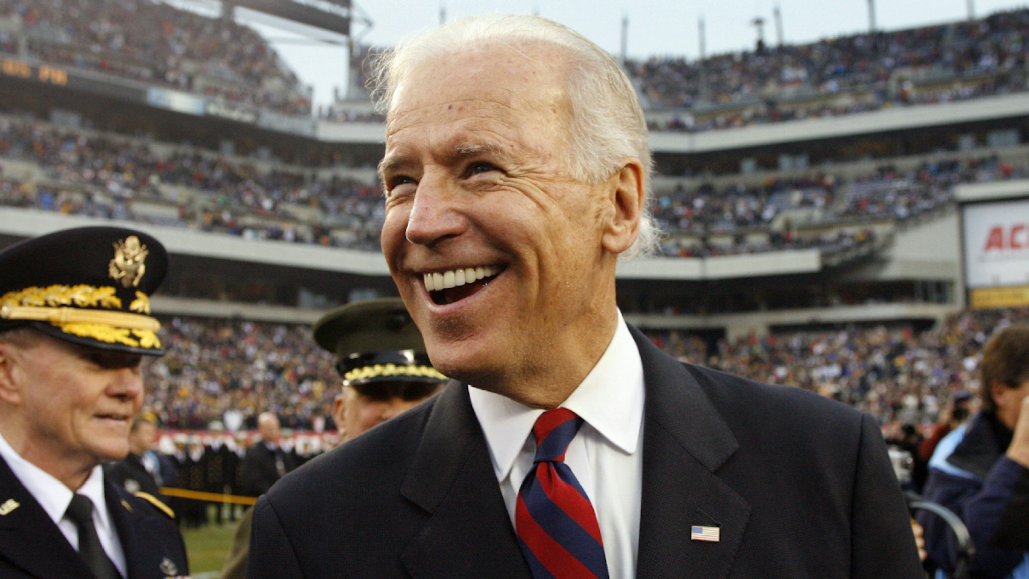 PHILADELPHIA - DECEMBER 8: Vice President of the United States Joe Biden smiles as he stands at midfield during the coin toss before a game between the Army Black Knights and the Navy Midshipmen on December 8, 2012 at Lincoln Financial Field in Philadelphia, Pennsylvania.