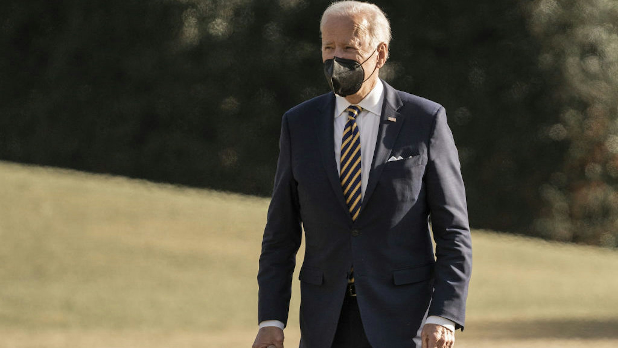 U.S. President Joe Biden walks on the South Lawn of the White House after arriving on Marine One in Washington, D.C., U.S., on Thursday, Feb. 10, 2022. Biden delivered remarks on lowering health care costs at Germanna Community College in Culpeper, Virginia. Photographer: Ken Cedeno/CNP/Bloomberg