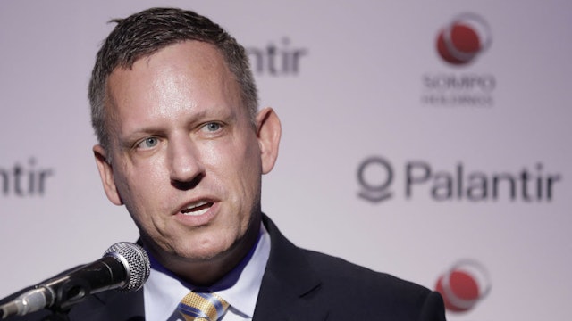 Peter Thiel, co-founder and chairman of Palantir Technologies Inc., speaks during a news conference in Tokyo, Japan, on Monday, Nov. 18, 2019. The billionaire entrepreneur was in Japan to unveil a $150 million, 50-50 joint venture with local financial services firm Sompo Holdings Inc. Palantir Technologies Japan Co. will target government and public sector customers, emphasizing health and cybersecurity initially. Photographer: Kiyoshi Ota/Bloomberg