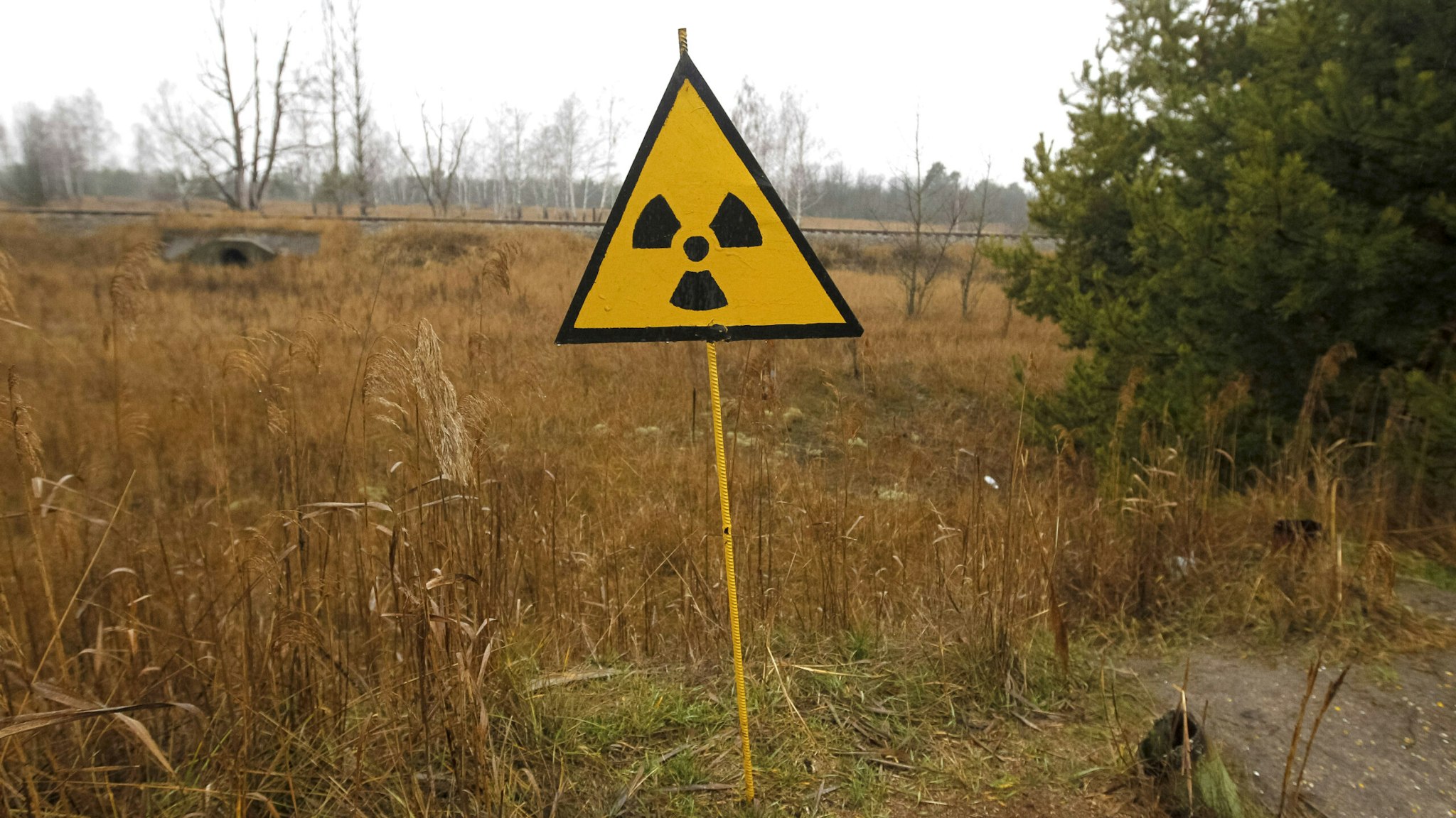 PRIPYAT, KIEV, UKRAINE - 2019/12/25: A radiation sign is seen at the Chernobyl Exclusion Zone in Kiev region, Ukraine.The Chernobyl nuclear accident on April 26, 1986 is regarded as the largest of its kind in the history of nuclear energy.
