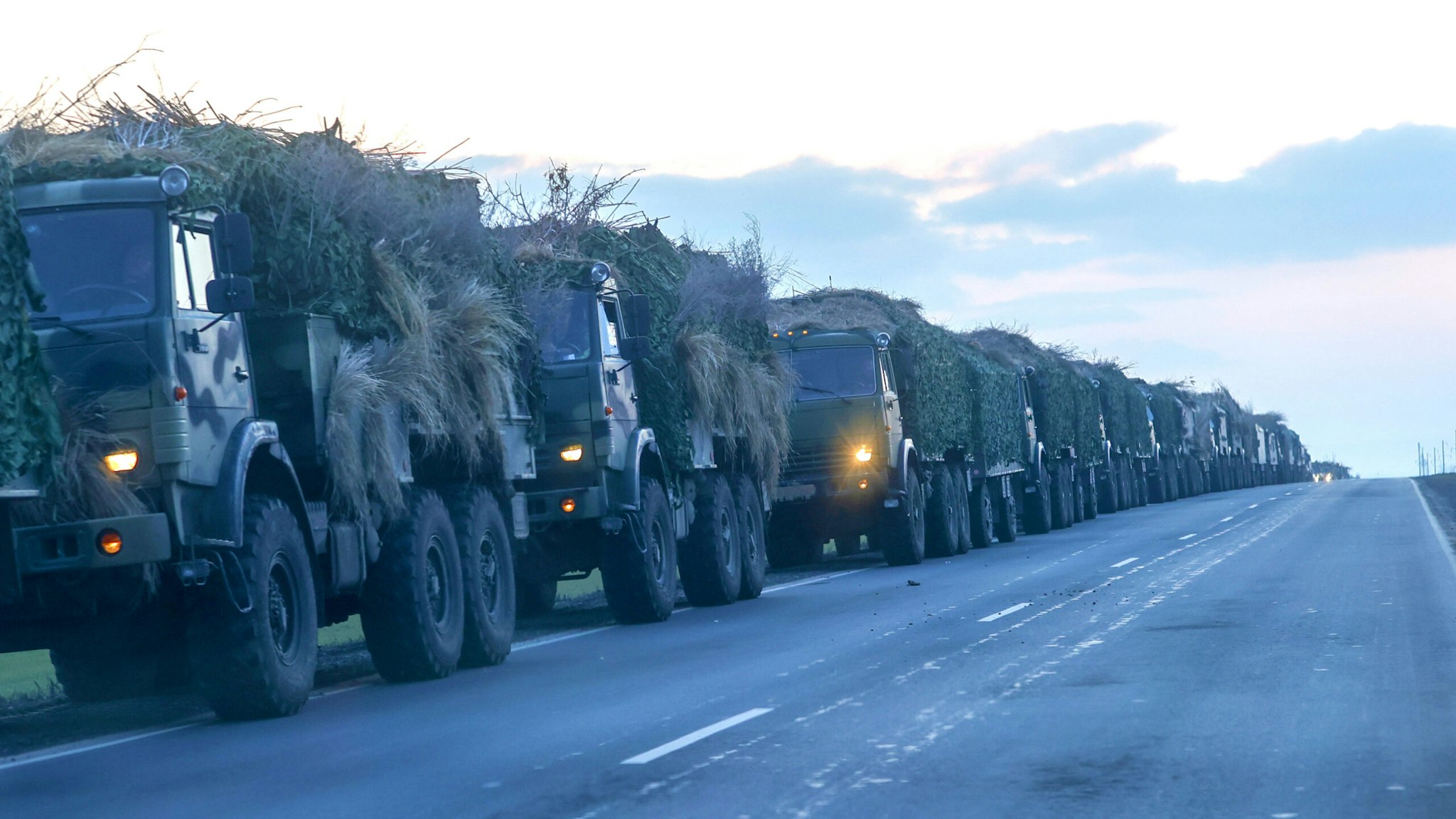 ROSTOV, RUSSIA - FEBRUARY 23: A convoy of Russian military vehicles is seen as the vehicles move towards border in Donbas region of eastern Ukraine on February 23, 2022 in Russian border city Rostov.