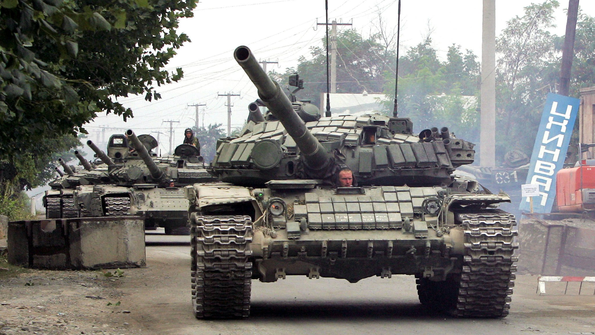 A column of Russian tanks leaves the South Ossetian capital Tskhinvali on August 21, 2008, to the border of Russian Federation. Russia's withdrawal of all its forces from Georgia will be completed on August 22, Defence Minister Anatoly Serdyukov announced on August 21, quoted by the Interfax news agency.