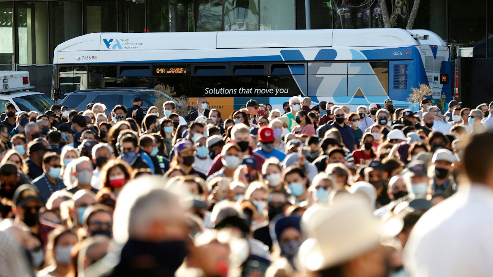 SAN JOSE - MAY 27: A VTA bus passes a public vigil on Thursday, May 27, 2021, at San Jose City Hall for victims of Wednesday's mass shooting at Valley Transportation Authority's maintenance yard in San Jose, Calif..