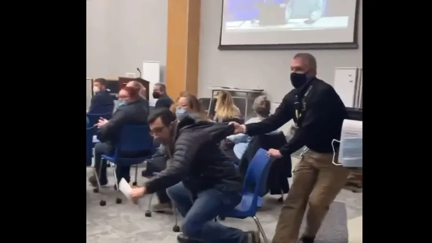 Security Guard At School Board Meeting Physically Removes Maskless Dad, Drags Him Out Of Meeting