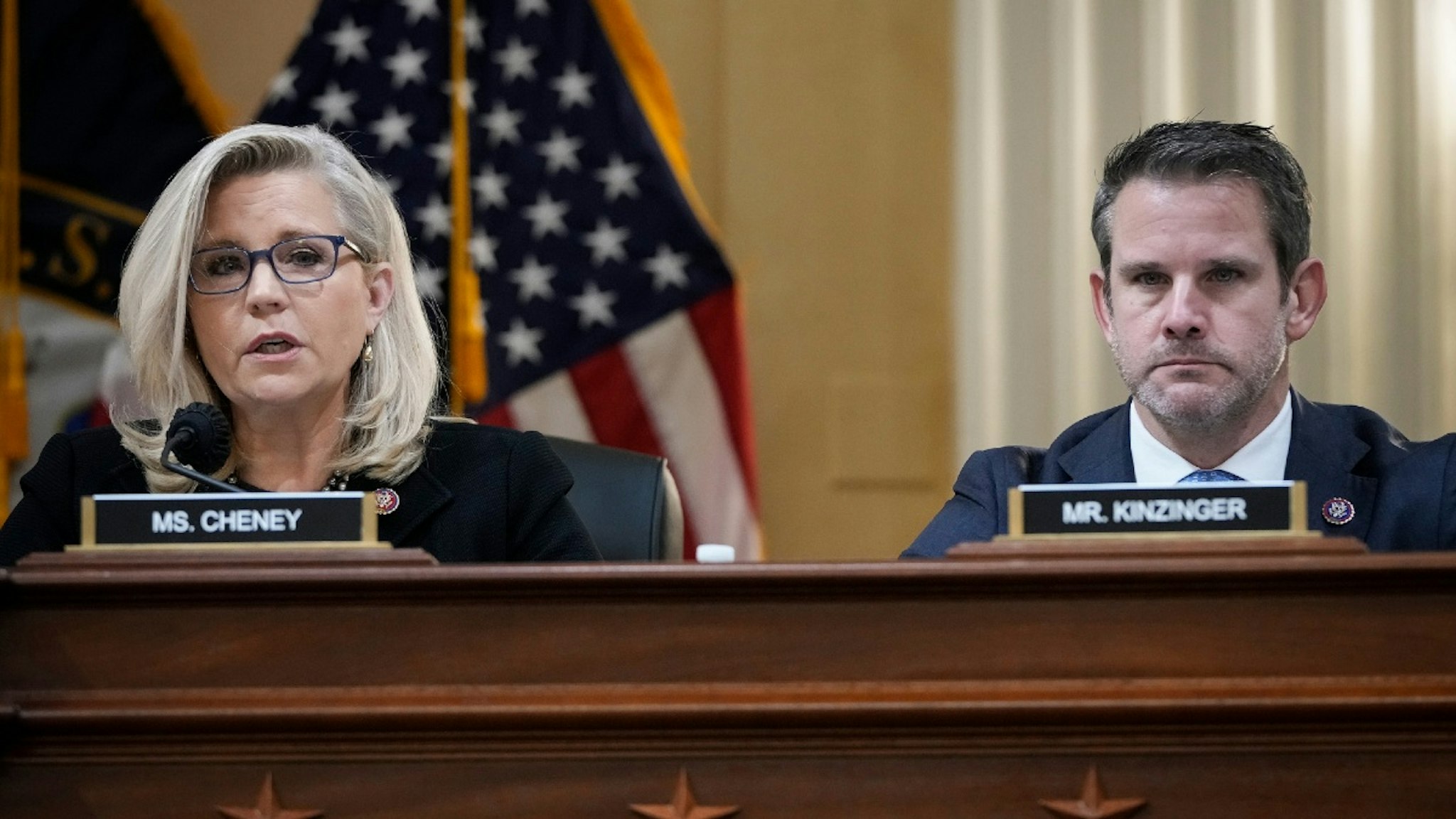 WASHINGTON, DC - DECEMBER 1: (L-R) Rep. Liz Cheney (R-WY), vice-chair of the select committee investigating the January 6 attack on the Capitol, and Rep. Adam Kinzinger (R-IL) listen during a committee meeting on Capitol Hill on December 1, 2021 in Washington, DC.