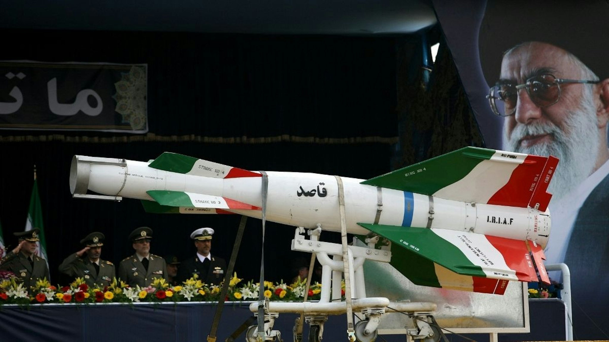 An Iranian surface to surface Ghasedak missile is driven past portraits of Iran's late founder of the Islamic Republic, Ayatollah Ali khamenei (R), during the annual army day military parade on April 17, 2008 in Tehran, Iran.