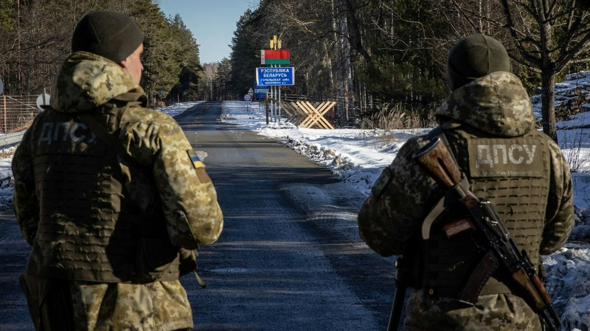 Members of the Ukrainian State Border Guard stand watch at the border crossing between Ukraine and Belarus on February 13, 2022 in Vilcha, Ukraine.