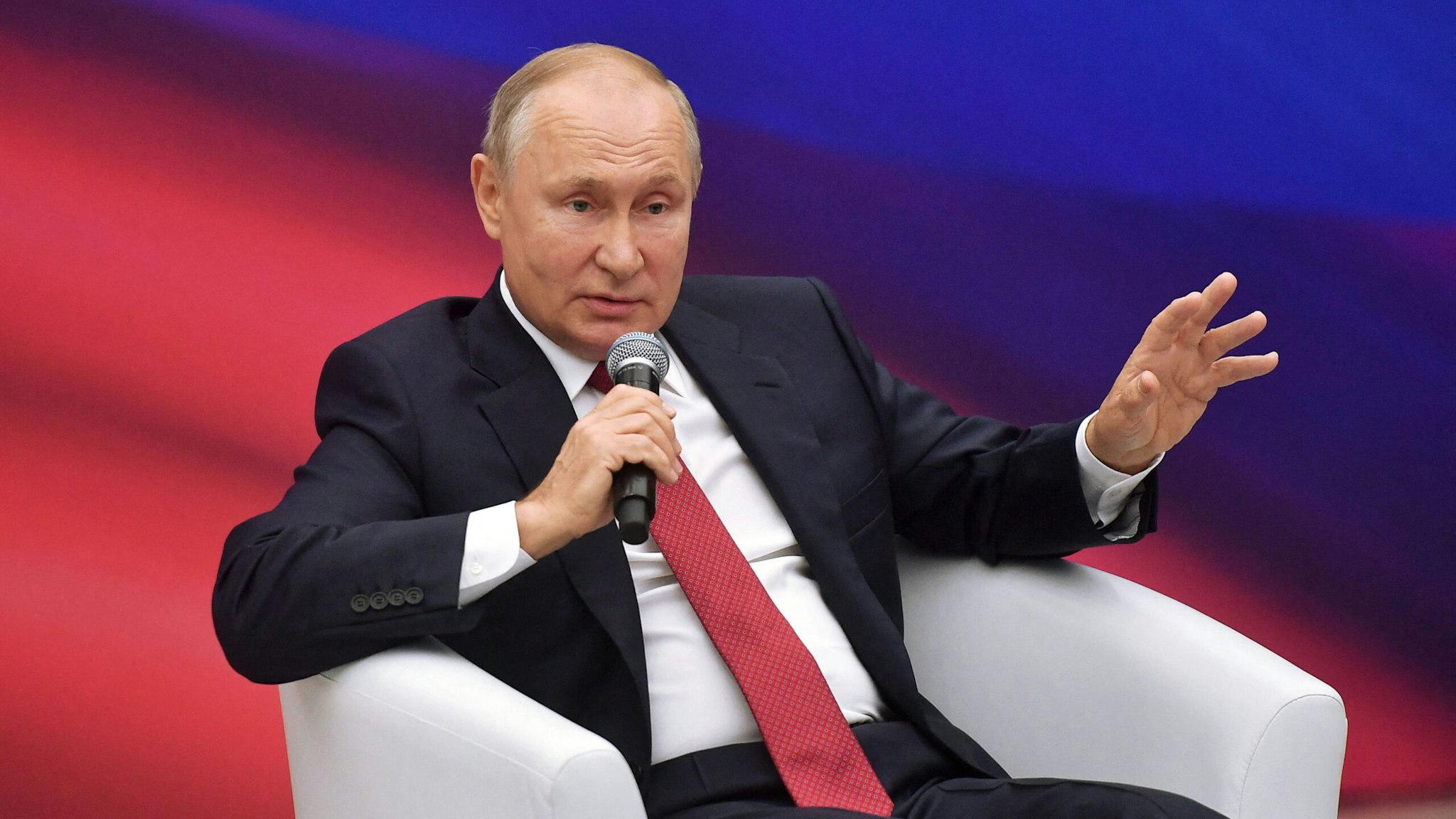 Russia's President Vladimir Putin speaks during a United Russia ruling party's members meeting in Moscow on August 22, 2021.
