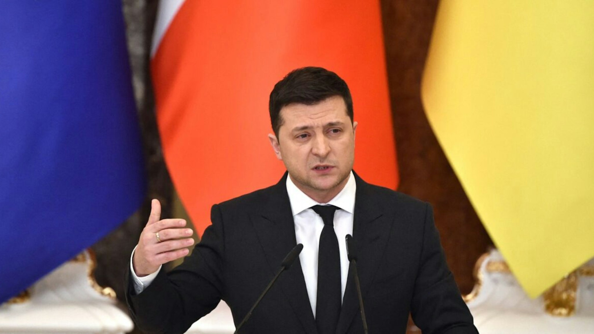 Ukrainian President Volodymyr Zelensky gestures during a joint press conference with French President following their meeting in Kyiv on February 8, 2022.
