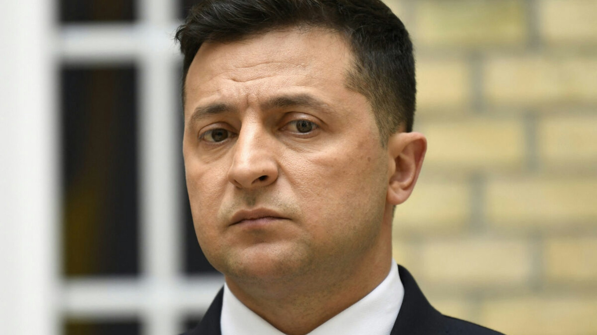 Ukrainian President Volodymyr Zelensky looks on during a press conference at the Ukraine's embassy in Paris on April 16, 2021 after a working lunch with French President