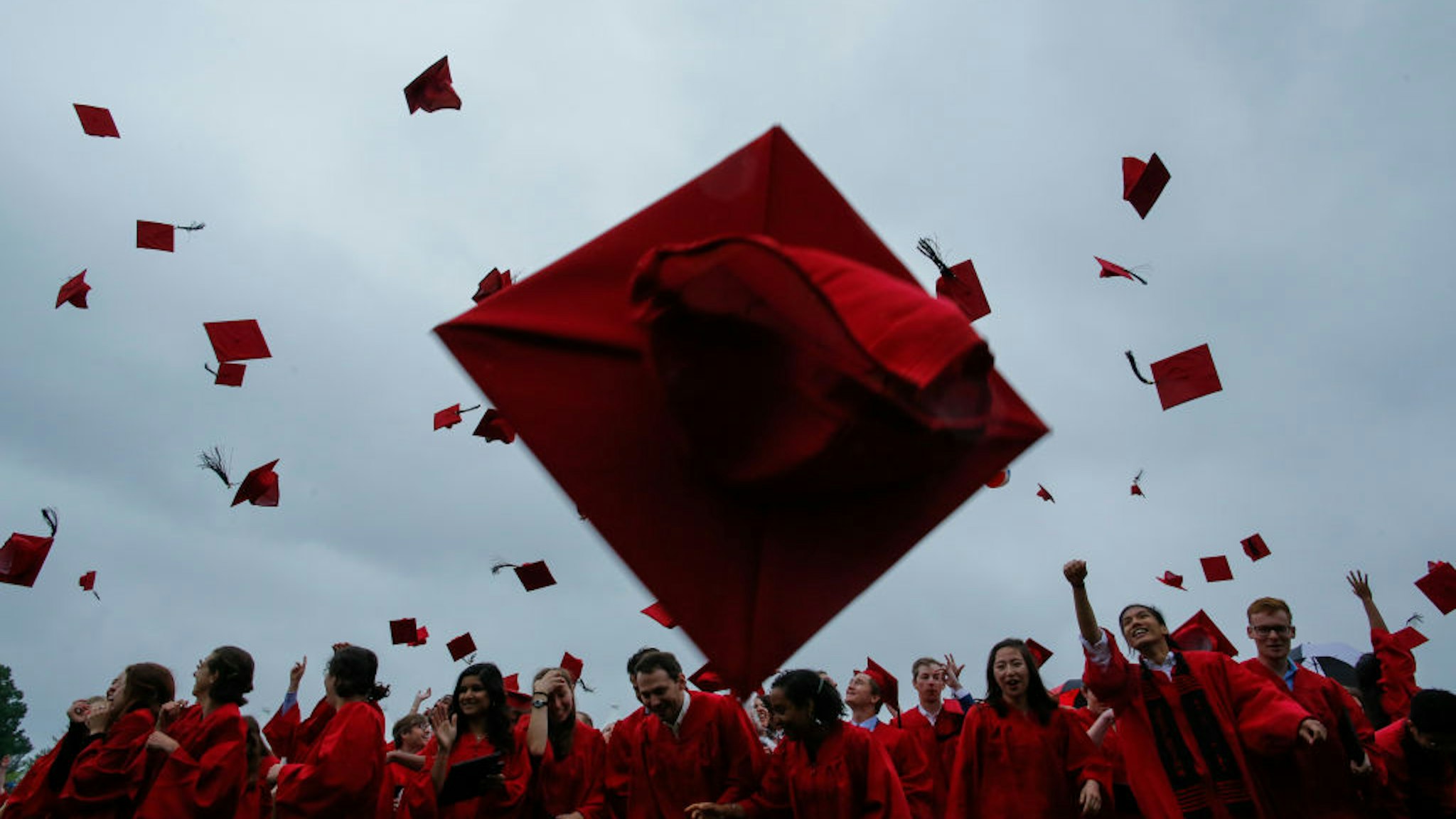 MIDDLETOWN, CT - MAY 27: Students toss their hats in the air at the conclusion of their Wesleyan commencement ceremony on May 27, 2018 at Wesleyan University in Middletown, Connecticut. Law professor Anita Hill spoke at the ceremony.
