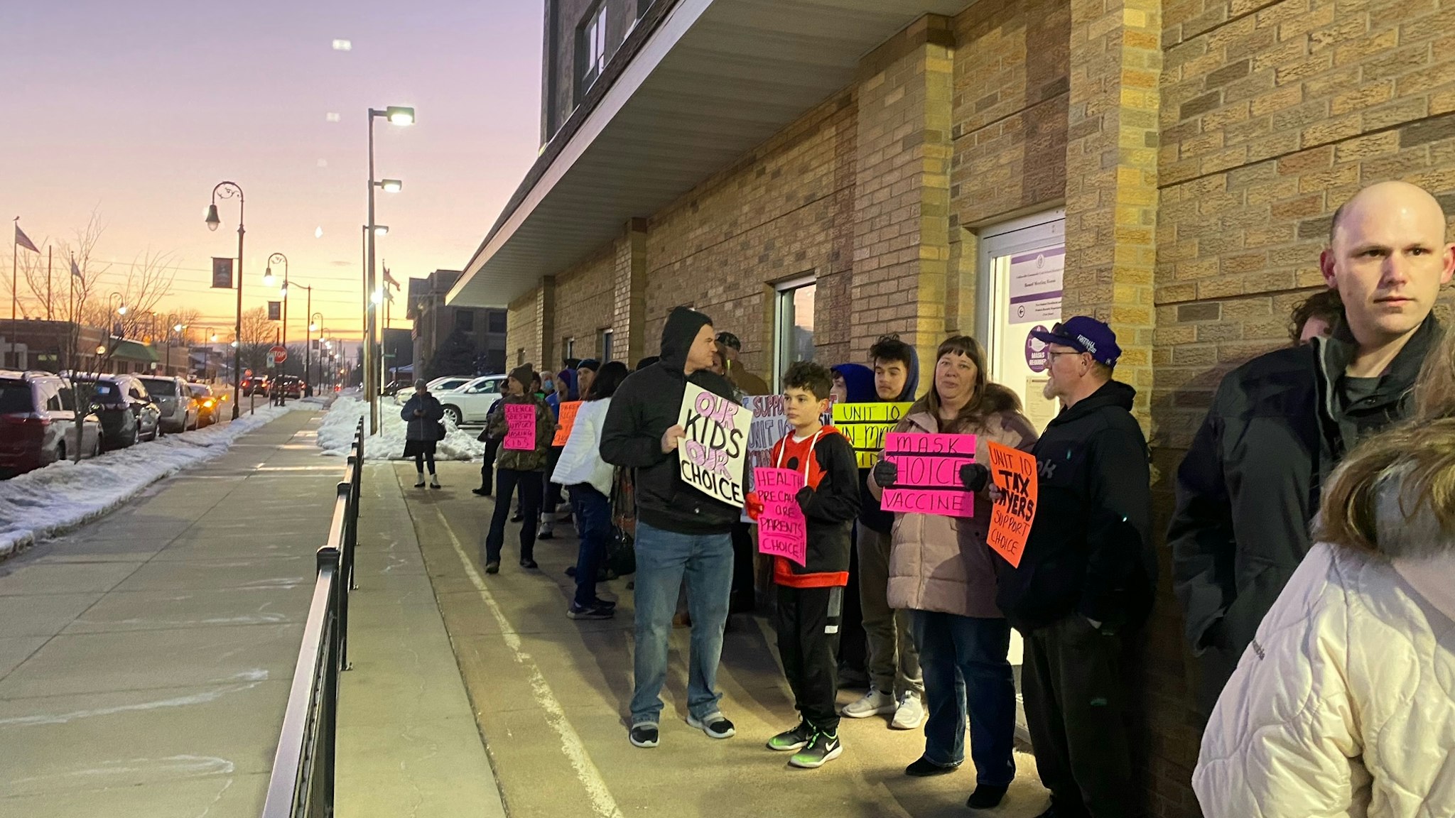 Parents wait outside the school district office in Collinsville, IL. Photo: Virginia Kruta