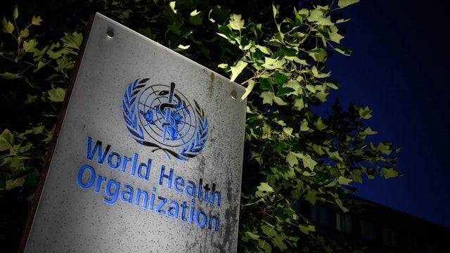 A photo taken in the late hours of May 29, 2020 shows a sign of the World Health Organization (WHO) at their headquarters in Geneva amid the COVID-19 outbreak, caused by the novel coronavirus.