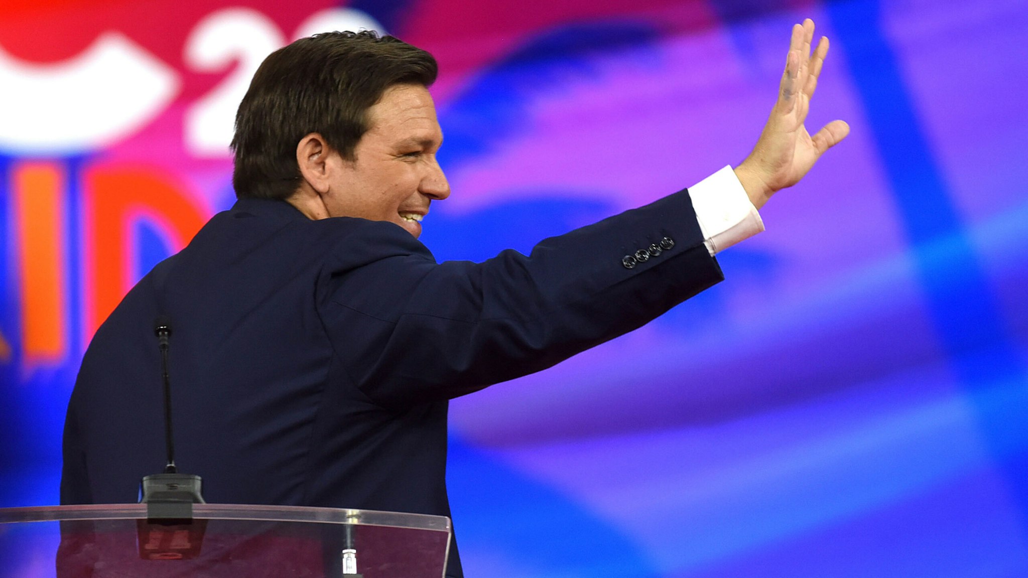ORLANDO, FLORIDA, UNITED STATES - 2022/02/24: Florida Republican Governor Ron DeSantis waves as he leaves the stage after addressing attendees on day one of the 2022 Conservative Political Action Conference (CPAC) in Orlando. Former U.S. President Donald Trump is also scheduled to speak at the four-day gathering of conservatives