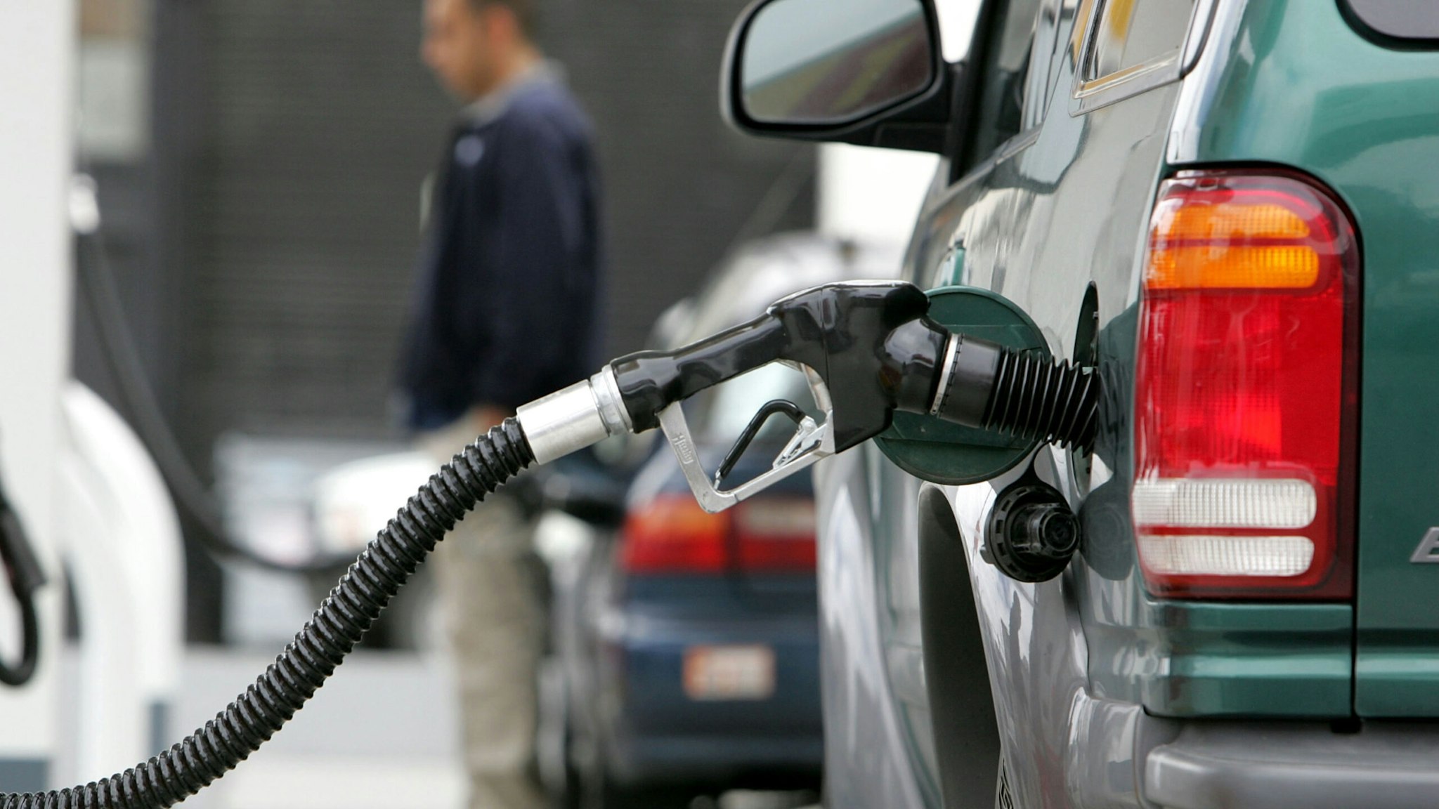 A gas pump pumps fuel into a car at a Shell service station June 27, 2005 in San Franisco, California.