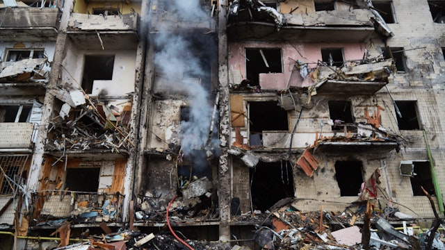 Firemen extinguish a fire inside a residential building that was hit by a missile on February 25, 2022 in Kyiv, Ukraine.